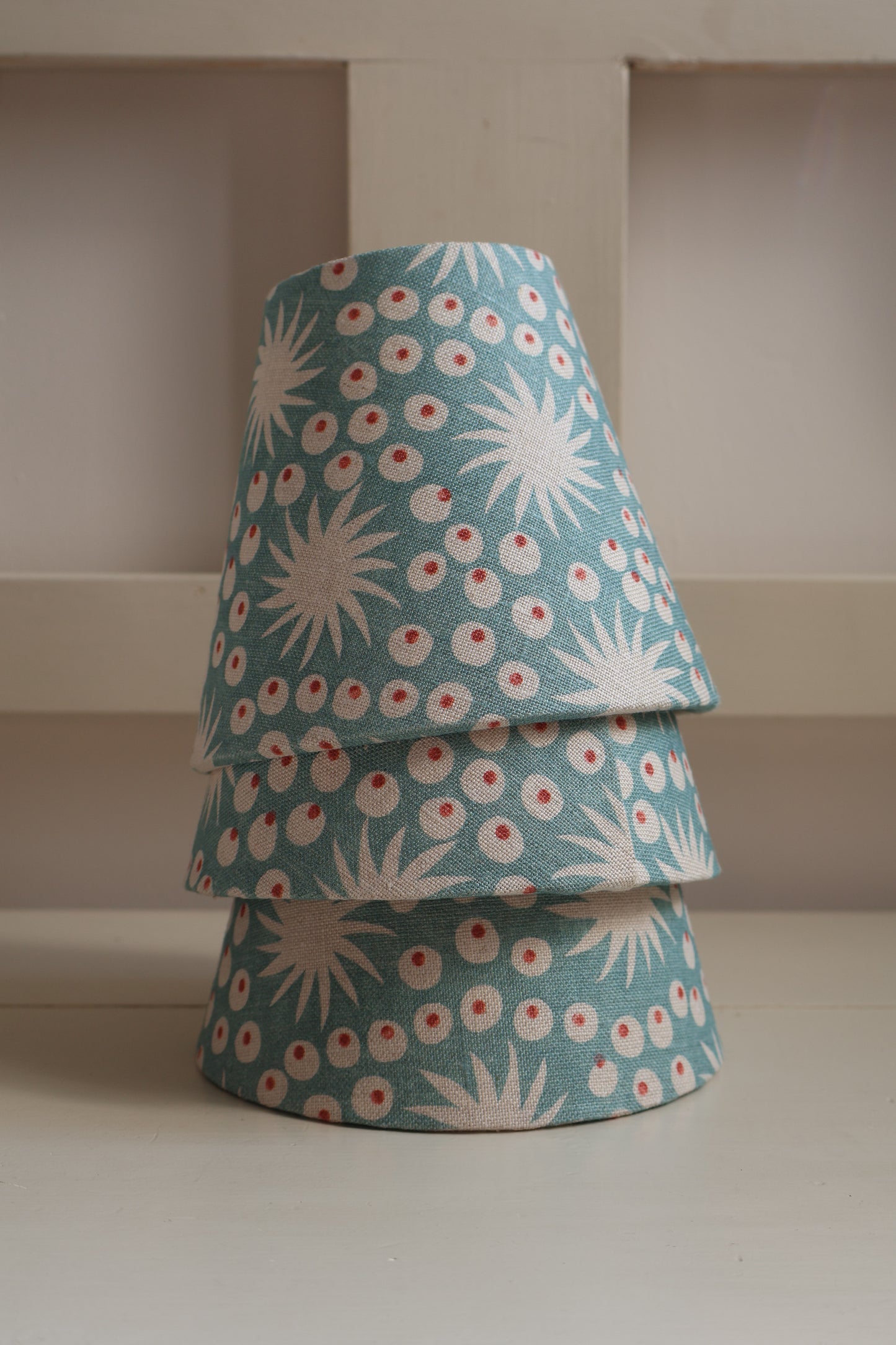 Small-batch handmade linen lampshade with blue pattern, ideal for wall lights, chandeliers, and bedside tables