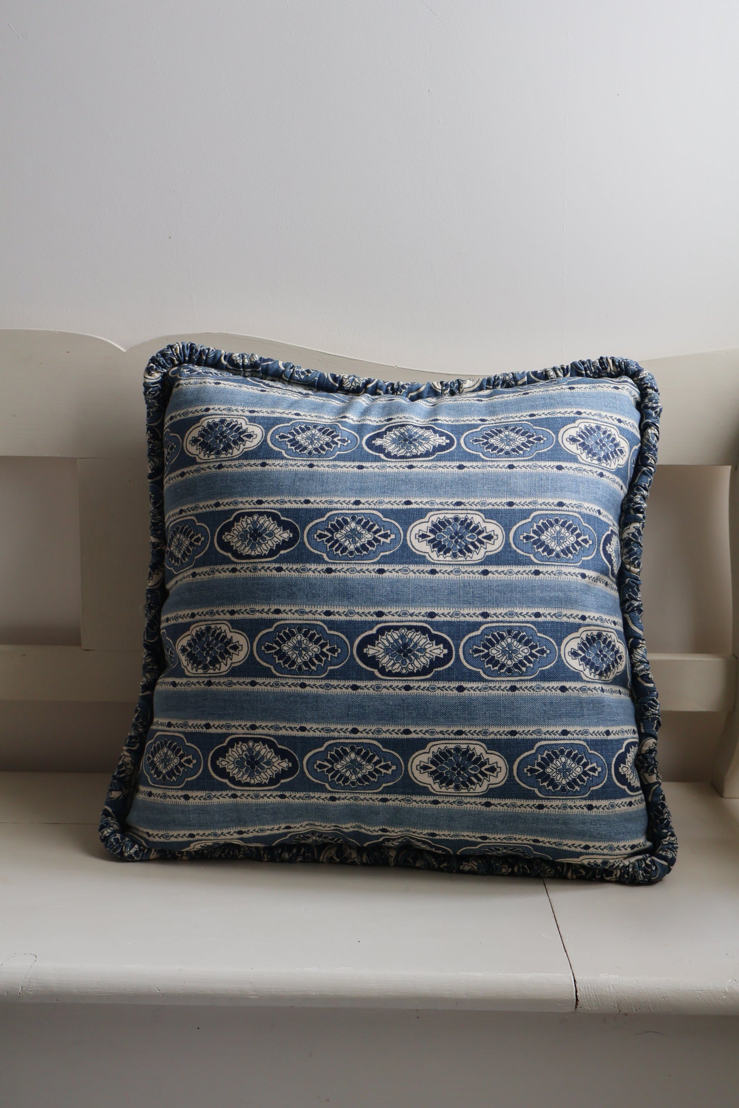 Amara square scatter cushion with blue repeating pattern