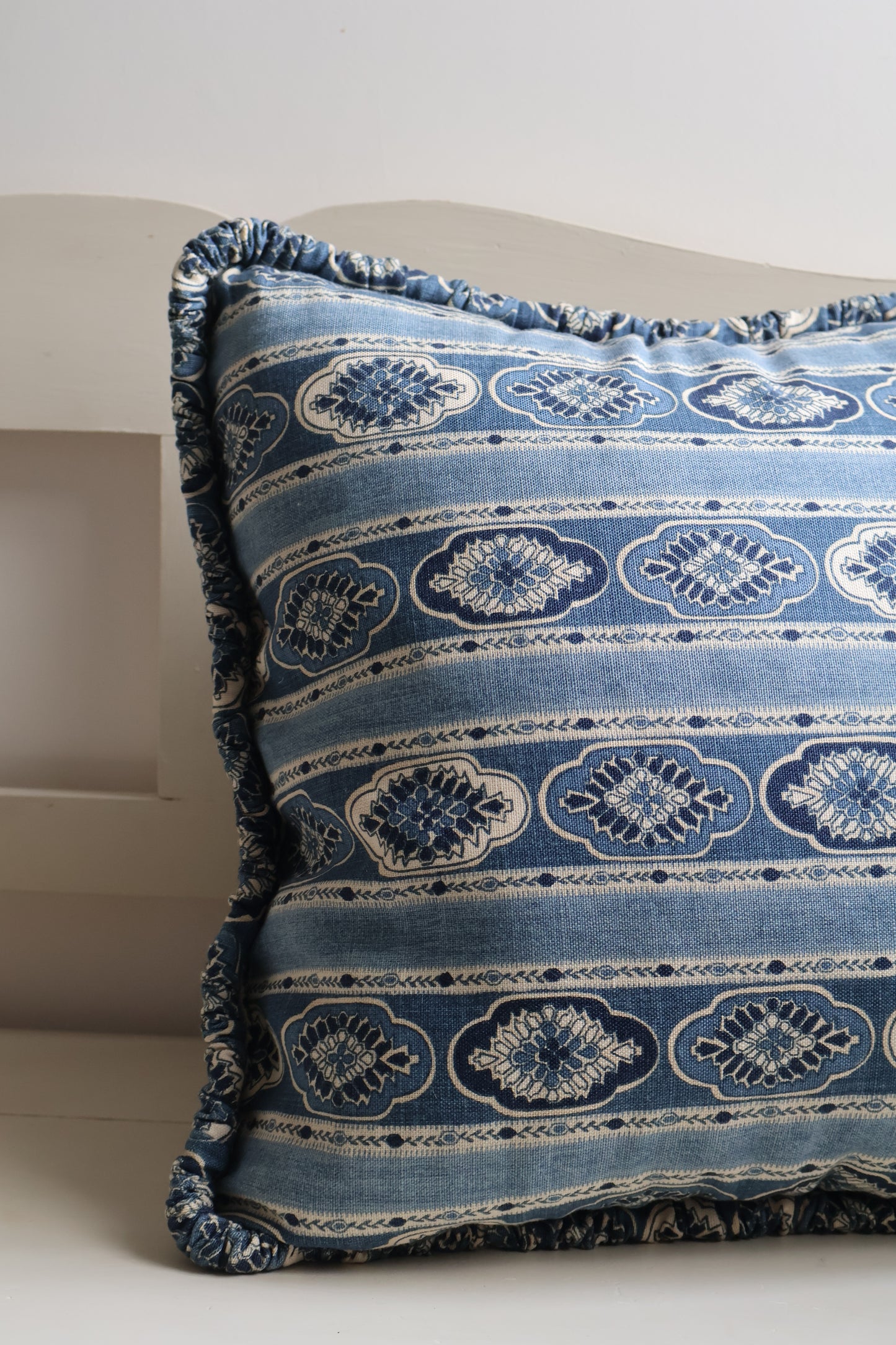 Close up of Amara square cushion with ruffle edge